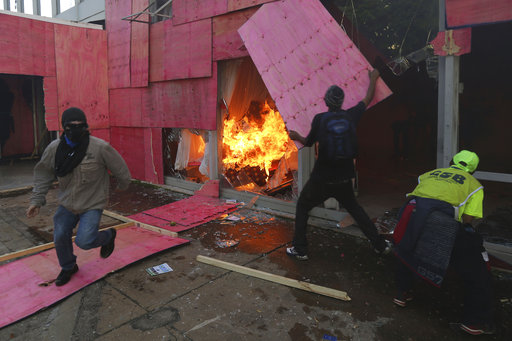 Demonstrators torch the Ministry of Agriculture during an anti-government protest in Brasilia