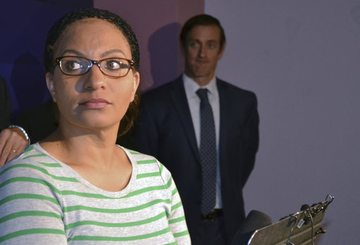 Jasmine Lima-Marin stands at a podium as she addresses the media during a news conference on Friday