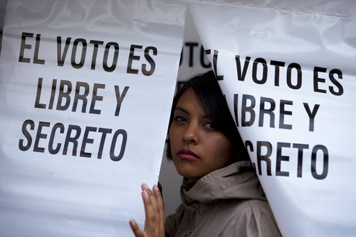 A woman emerges from a privacy booth