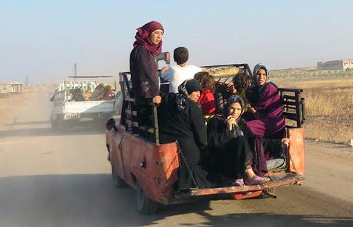 This photo provided by the Syria Press Center (SPC)