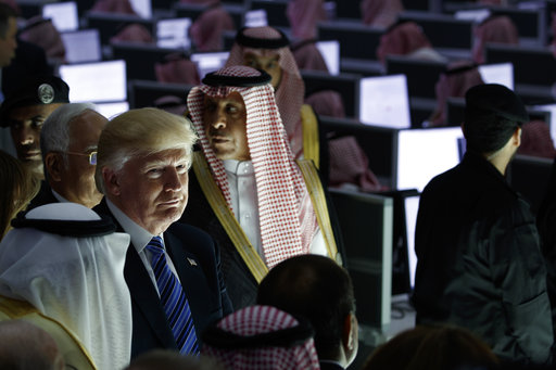President Donald Trump listens during a ceremony to mark the opening of the Global Center for Combatting Extremist Ideology