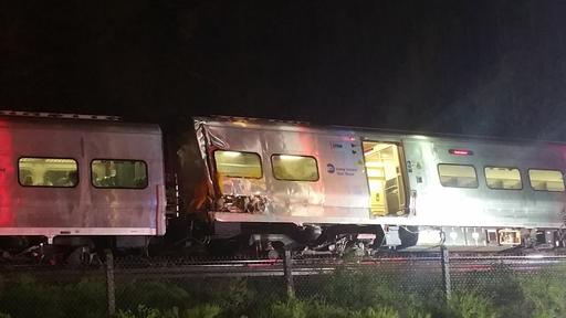 In this photo provided by Sarah Qamar shows a Long Island Railroad train derailed near New Hyde Park