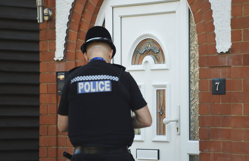 A police officer at the scene at an address in Nuneaton