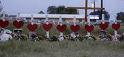 Crosses for members of the Holcombe family are part of a makeshift memorial for the victims of the church shooting at Sutherland Springs Baptist Church placed along the highway