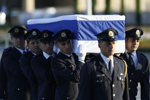 Members of the Knesset guard carry the coffin of former Israeli President Shimon Peres at the Knesset