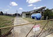 A gate at the U.S. Oil Recovery Superfund site is shown Thursday