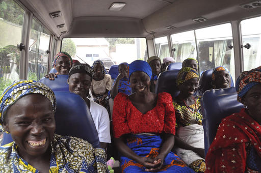 Family members of the Nigerian Chibok kidnapped girls share a moment as they depart to the Nigerian minister of women affairs in Abuja