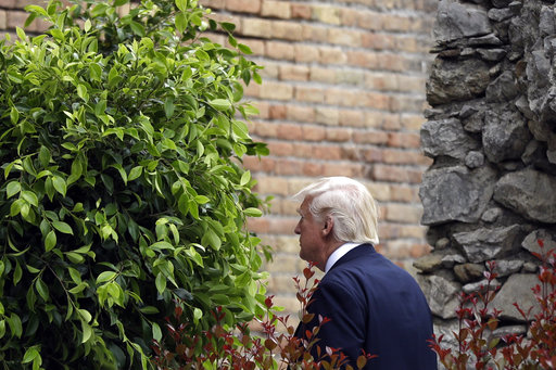 US President Donald Trump arrives for a welcome ceremony for the G7 summit in the Ancient Theatre of Taormina (3rd century BC) in the Sicilian citadel of Taormina