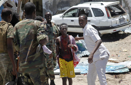 Somali soldiers help a man