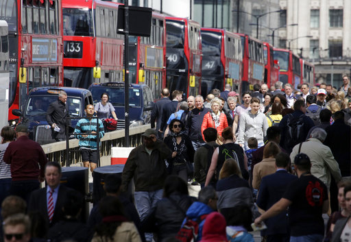 People cross London Bridge