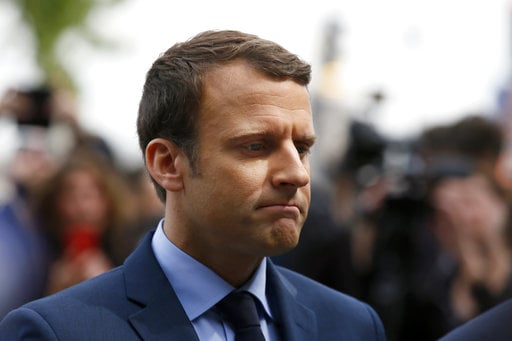 French centrist presidential candidate Emmanuel Macron pays respect during a ceremony marking 102nd anniversary of the slaying of Armenians by Ottoman Turks in a brief ceremony