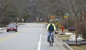 Bill Gurolnick rides his bike near his home in Northbrook