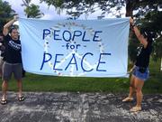 Guam residents hold "people for peace" as about a hundred people gathered at Chief Kepuha Park in Hagatna