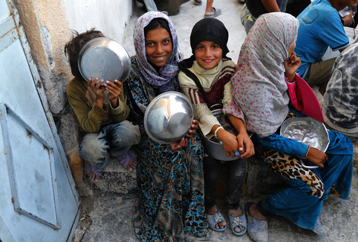 Syrian displaced girls who fled with their families the battle between U.S.-backed Syrian Democratic Forces and the Islamic State militants from Raqqa city