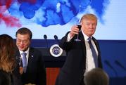 U.S. President Donald Trump and South Korean President Moon Jae-in toast at the start of a dinner at the Blue House in Seoul