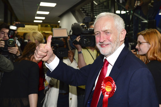 Britain's Labour party leader Jeremy Corbyn gestures as he arrives for the declaration at his constituency in London