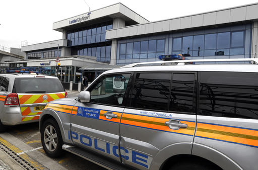 Police cars parked outside London City Airport