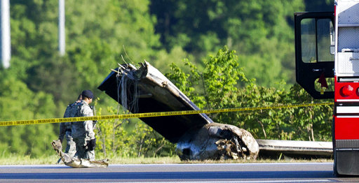 Part of a cargo plane lays on the ground following a fatal crash at Yeager Airport in Charleston