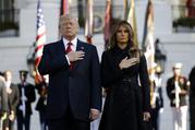 President Donald Trump and first lady Melania Trump stand for a moment of silence to mark the anniversary of the Sept. 11 terrorist attacks