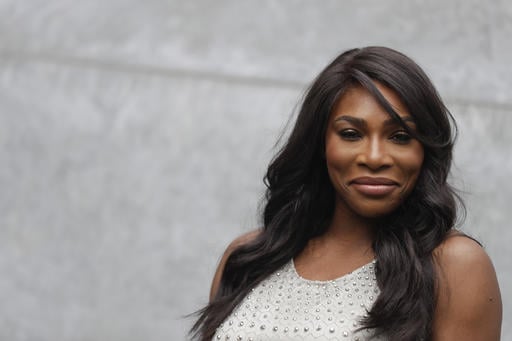 U.S. tennis star Serena Williams poses for photographers prior to the start of the Giorgio Armani women's Spring-Summer 2017 fashion show
