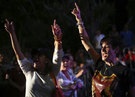 Opposition members shout slogans against Venezuela's President Nicolas Maduro as they waits for the results of a of a symbolic referendum in Caracas