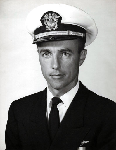 This undated photo provided by the U.S. Navy shows Lt. Commander Frederick P. Crosby in his official Navy portrait. Daughter Deborah Crosby has worked for more than half a century on getting her father's remains recovered from Vietnam after his Navy plane was shot down there in 1965. She is finally going to get to see him buried in his hometown of San Diego with full military honors. Crosby and her brothers will receive a flag-draped casket carrying the remains of Lt. Commander Crosby on Friday