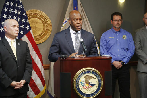 FBI Special Agent in Charge Eric Jackson talks about the FBI's roll in stopping a bomb plot. Acting U.S. Attorney Tom Beall (left) announced Friday a major federal investigation stopped a domestic terrorism plot by a militia group to detonate a bomb at a Garden City apartment complex where a number of Somalis live.Two Liberal men and a Dodge City resident were arrested and charged in federal court with domestic terrorism charges