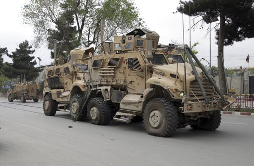 A damaged U.S. military vehicle is pictured at the site of a suicide attack in Kabul