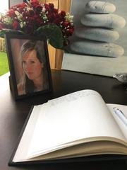 A book of condolence is open next to a portrait of victim of the New York terror attack Ann-Laure Decadt in a community centre in Staden Belgium  Wednesday Nov. 1