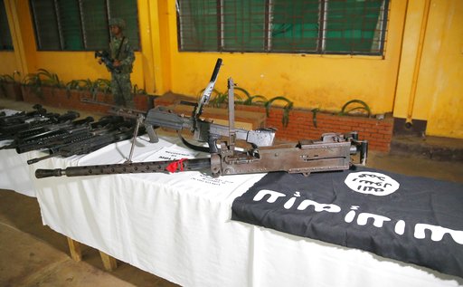 A Philippine Marine guards high-powered firearms