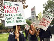 Demonstrators protest outside a speech by conservative provocateur Milo Yiannopoulos