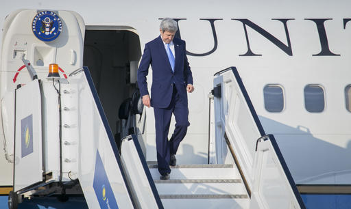 U.S Secretary of State John Kerry disembarks from his aircraft upon his arrival at the airport in Kigali