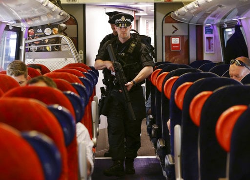 Armed British Transport Police Specialist Operations officers on board a  train to Birmingham New Street at Euston station in London as armed police officers are patrolling on board trains nationwide for the first time Thursday May 25