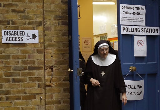 A Benedictine nun from Tyburn Convent leaves after voting in Britain's general election at a polling station in St John's Parish Hall