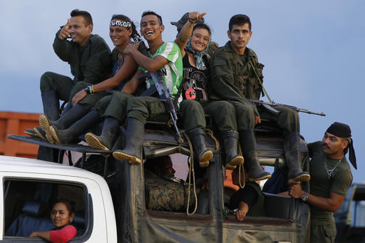 Rebels of the Revolutionary Armed Forces of Colombia (FARC) arrive to El Diamante in southern Colombia