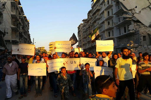 Activists in Syrias besieged Aleppo protest against the United Nations for what they say is its failure to lift the siege off their rebel-held area