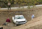 Investigators view a pickup truck involved in a deadly shooting rampage at the Rancho Tehama Reserve