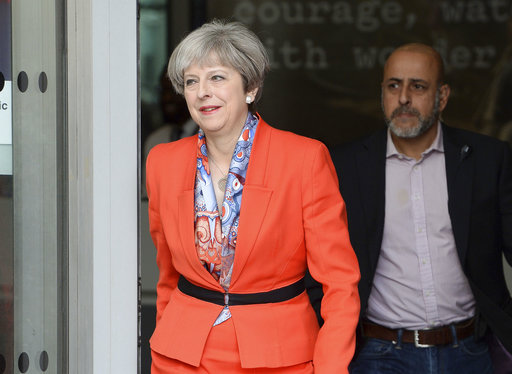 Prime Minister Theresa May leaves BBC studios in London after appearing on a morning show Sunday April 30
