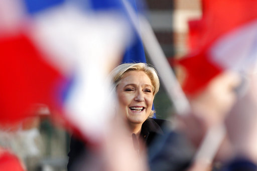 French far-right leader and presidential candidate Marine Le Pen addresses people in Ennemain
