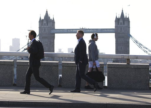 Commuters cross London Bridge