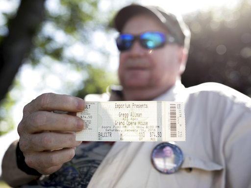 Mark Elliott shows a concert ticket from the last Gregg Allman concert he attended