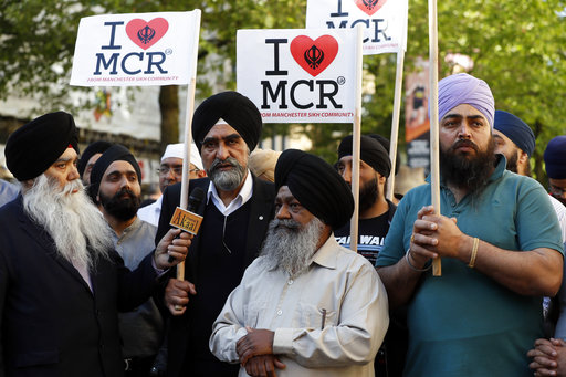 Members of the Manchester Sikh Community attend a vigil in Albert Square