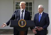 President Donald Trump answers questions with Senate Majority Leader Mitch McConnell