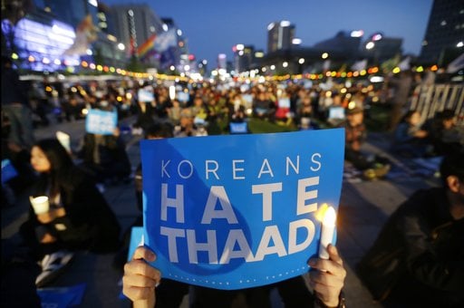 South Korean protesters stage a rally to oppose a plan to deploy the advanced U.S. missile defense system called Terminal High-Altitude Area Defense