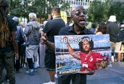 Eric Hamilton of New York joins others gathered in support of unsigned NFL quarterback Colin Kaepernick on Wednesday