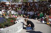 Jenni Tillett writes a message at the Las Vegas Community Healing Garden