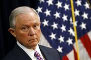 Attorney General Jeff Sessions listens to a reporter's question during a news conference in Baltimore