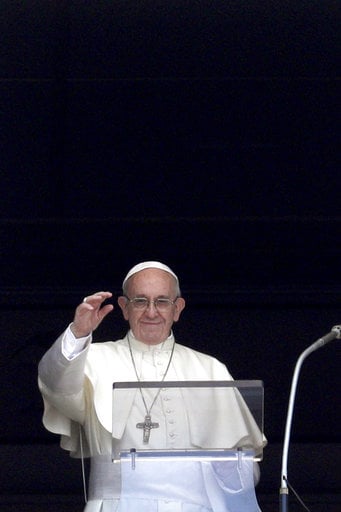 Pope Francis recites the Angelus noon prayer from the window of his studio overlooking St.Peter's Square