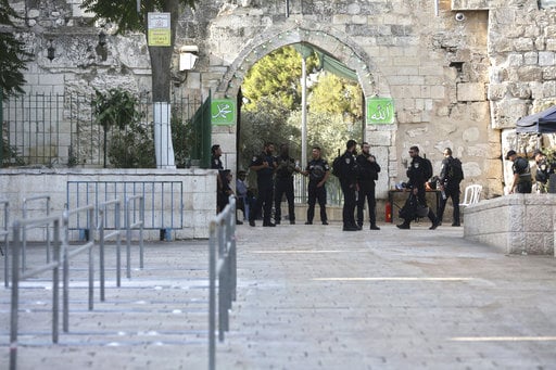 Israeli police officers stand outside the Al Aqsa Mosque compound in Jerusalem's Old City Tuesday