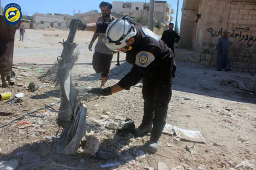 In this photo provided by the Syrian Civil Defense group known as the White Helmets